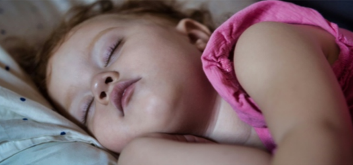 Peaceful sleeping baby in a cozy nursery environment